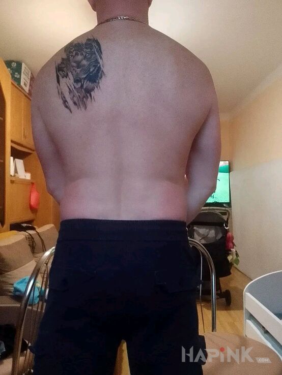 Tattoo Mój in black and gray motif and realistic style on the back