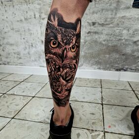 Tattoo Realistic Owl by Kris on the leg motif: black and gray style: realistic