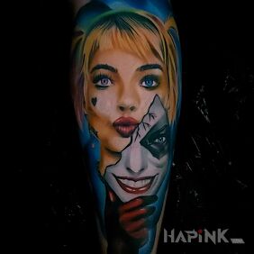 Tattoo Harley Quinn on the upper arm motif: characters style: realistic