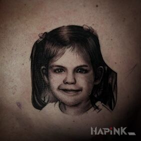Tattoo Little girl on the ribs motif: black and gray style: realistic