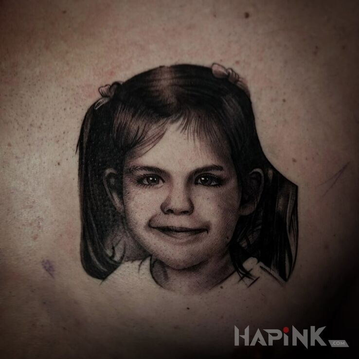 Tattoo Little girl in faces motif and realistic style on the ribs