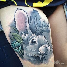Tattoo Bunny on the leg motif: flowers