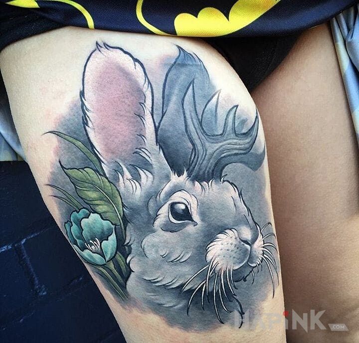 Tattoo Króliczek in flowers motif on the leg