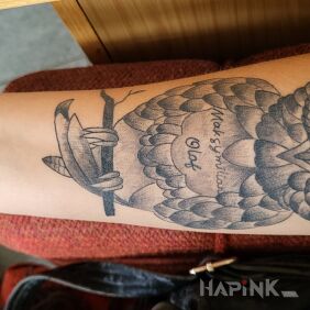 Tattoo Furious owl On the arm motif: animals style: graphic / illustrative