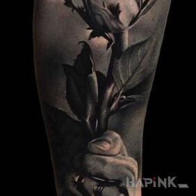 Tattoo Bloodied hand on the forearm motif: 3D style: realistic
