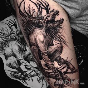 Tattoo Demon on the thigh motif: black and gray style: graphic / illustrative