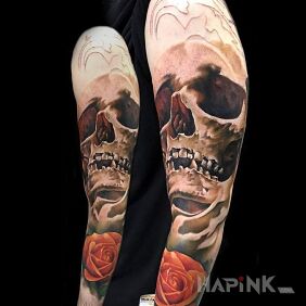 Tattoo Chest and rose on the upper arm motif: skulls style: realistic