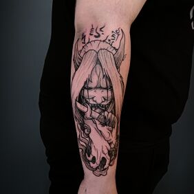 Tattoo Naruto demon reaper on the forearm motif: black and gray style: graphic / illustrative
