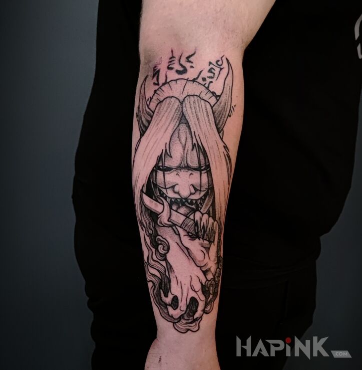 Tattoo Naruto demon reaper in black and gray motif and graphic / illustrative style on the forearm