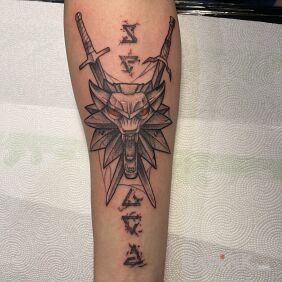 Tattoo Witcher amulet and signs On the arm motif: fantasy style: graphic / illustrative