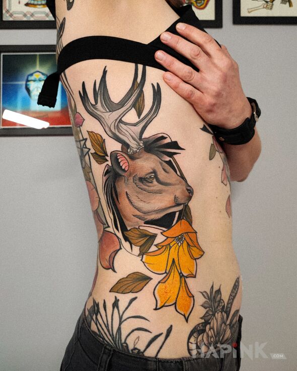 Tattoo Joloń in animals motif and neo-traditional style on the ribs