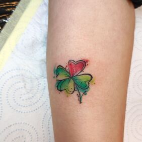 Tattoo Forearm tattoo colorful clover on the forearm motif: floral style: Watercolor