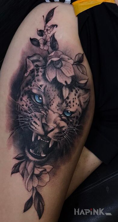 Tattoo Lampart in animals motif and realistic style on the thigh