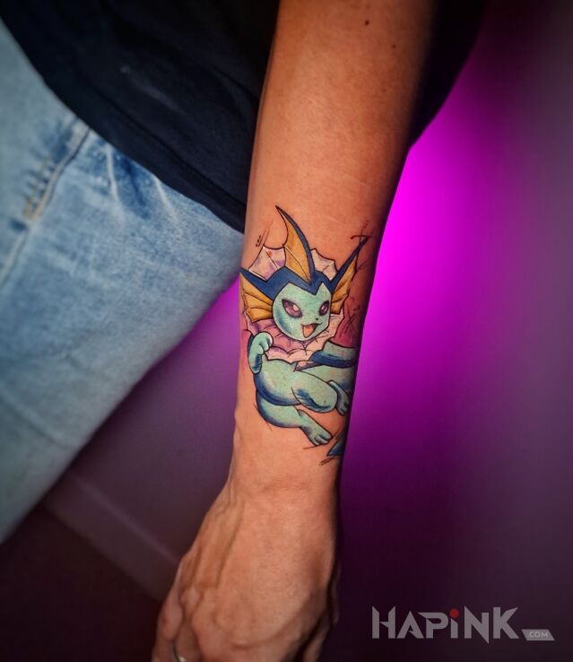 Tattoo Kolorowy pokemon na przedramieniu in colorful motif and cartoon / comic book style on the forearm