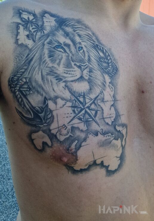 Tattoo Lew in animals motif and realistic style on the chest
