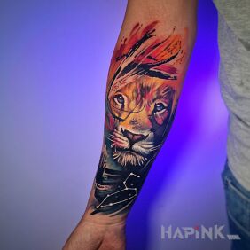 Tattoo Colorful lion made in watercolor style On the arm motif: colorful style: realistic