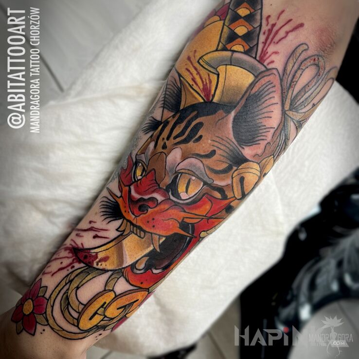 Tattoo Kot Hannya in animals motif and neo-traditional style on the forearm