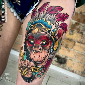 Tattoo Chimpanzee in a headdress on the leg motif: colorful style: neo-traditional