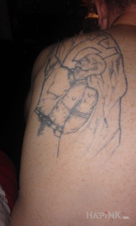 Tattoo Do zakrycia in characters motif on the back
