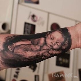 Tattoo Child on the forearm motif: 3D style: realistic