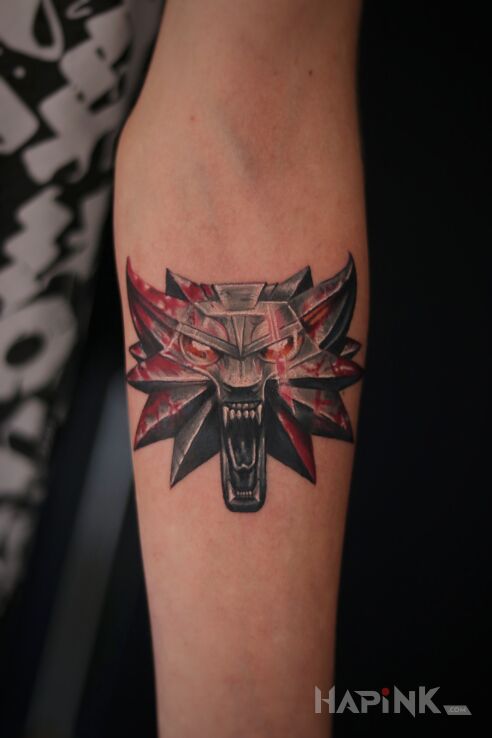 Tattoo The Witcher, tatuaż wiedzmin in objects motif and realistic style on the forearm
