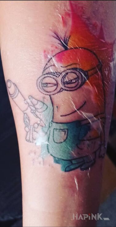 Tattoo Minionek 🥰 in colorful motif and cartoon / comic book style on the forearm