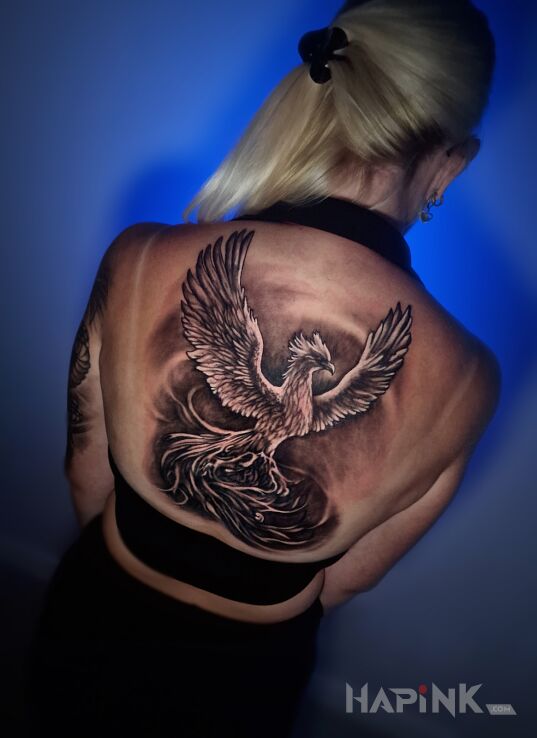 Tattoo Feniks na plecach in fantasy motif and realistic style on the back