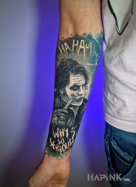 Tattoo Joker na przedramieniu, why so serious tattoo in lettering motif and realistic style on the forearm