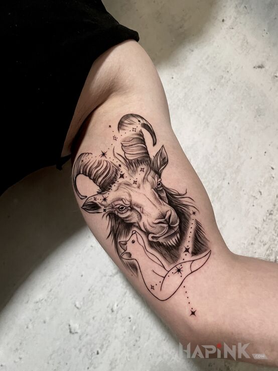 Tattoo Kozioł w konstelacji in animals motif and realistic style on the bicep