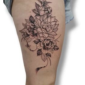 Tattoo Flowers on the thigh motif: black and gray style: graphic / illustrative