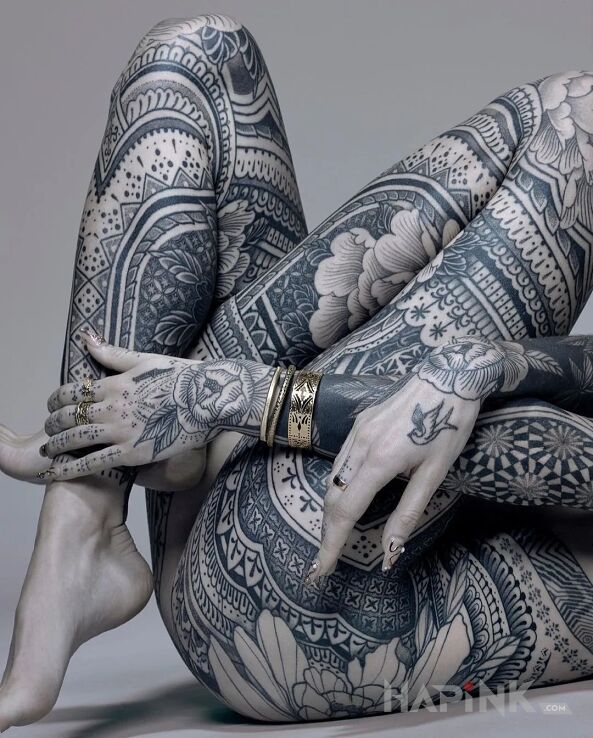 Tattoo Ornamentalnie in black and gray motif and graphic / illustrative style on the leg