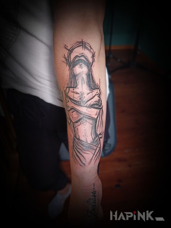 Tattoo Santa madonna in characters motif and sketch style On the arm