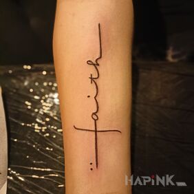 Tattoo Faith On the arm motif: lettering style: calligraphy