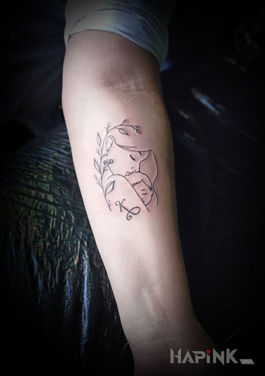 Tattoo Madonna in Love motif and contour / linework style on the forearm