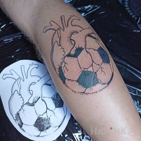 Tattoo Heart with a ball on the calf motif: Sport style: contour / linework