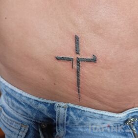 Tattoo Cross on the stomach style: minimalistic