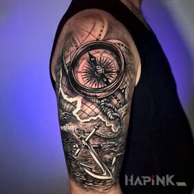 Tattoo Compass, anchor and map on the arm On the arm motif: objects style: realistic