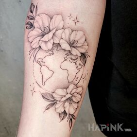 Tattoo World in Flowers On the arm motif: black and gray style: graphic / illustrative