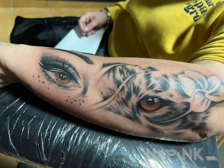Tattoo Beaty and beast in animals motif and realistic style on the forearm