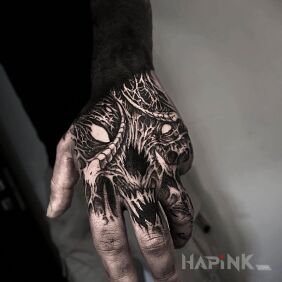 Tattoo Monstrous little hand on the hand motif: black and gray style: organic