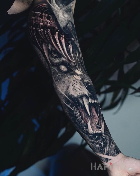 Tattoo Piekielny wilczur in dark motif and realistic style on the bicep