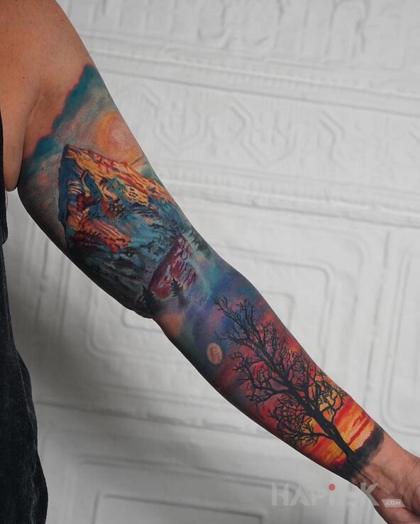 Tattoo Kolorowe góry in nature motif and realistic style on the forearm