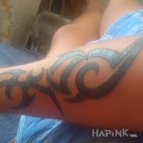 Tattoo Dziara on the forearm style: tribal