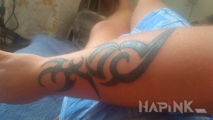 Tattoo Dziara in tribal style on the forearm