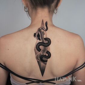 Tattoo Woman and snake on the back motif: characters style: realistic