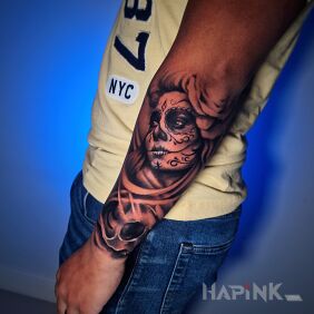 Tattoo Santa muerte on the forearm on the forearm motif: black and gray style: realistic