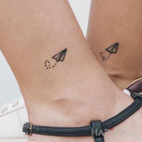 Tattoo Let's fly away near the ankle motif: black and gray style: minimalistic