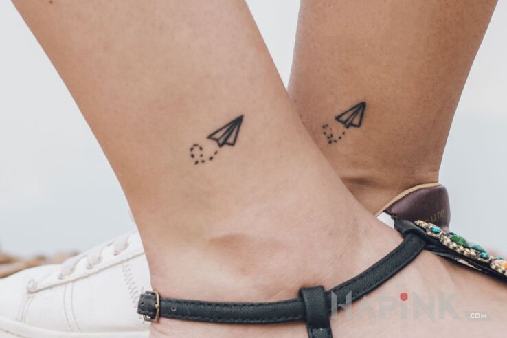 Tattoo Let's fly away in black and gray motif and minimalistic style near the ankle