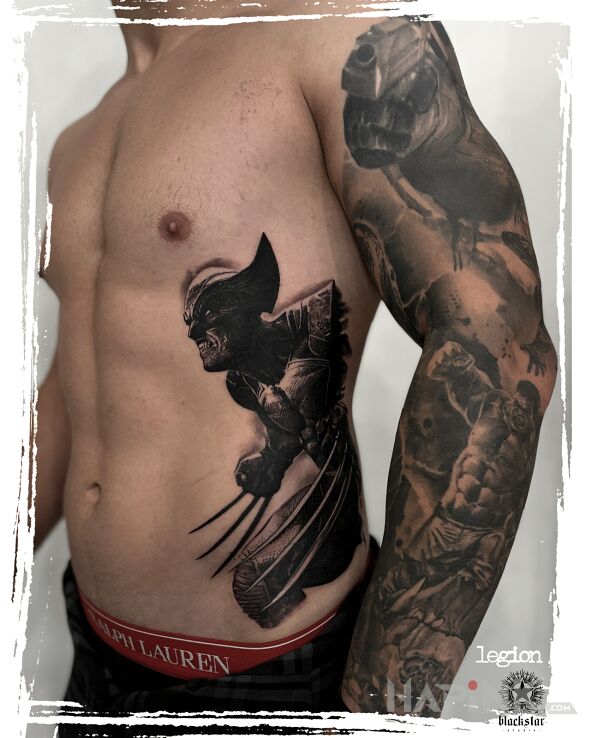 Tattoo Wolverine. in sleeves motif and realistic style on the forearm