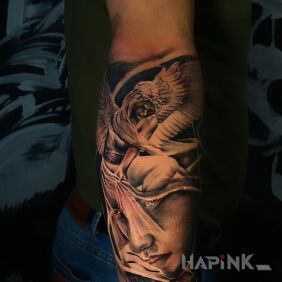 Tattoo Little Angel On the arm motif: black and gray style: realistic
